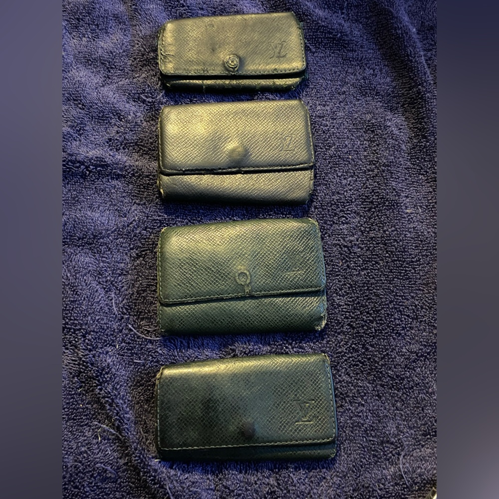Lot of 4 Louis Vuitton Tiaga leather keychain wallets